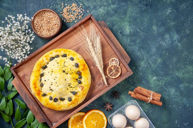 Top view sweet pie inside wooden desk on a dark-blue background hotcake fruit bake cake cookie dessert pastry bake pie