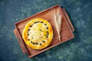 Free photo top view sweet pie inside wooden desk on dark blue background hotcake fruit bake pie cake cookie dessert pastry bake