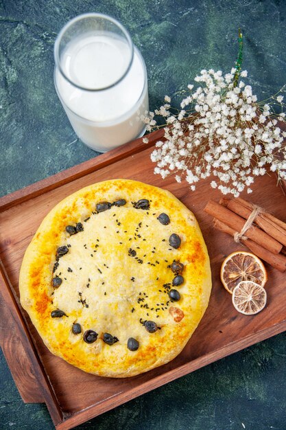 Top view sweet pie with milk on dark blue background fruit bake pie cake bake cookie hotcake dessert pastry