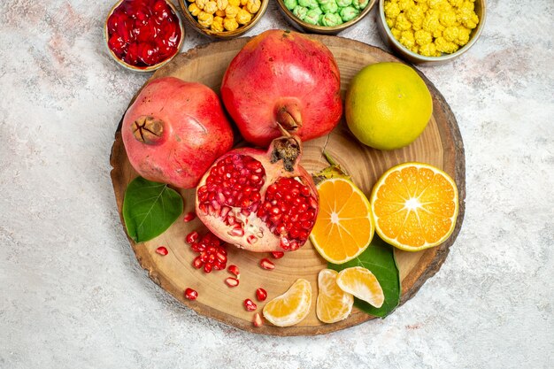 Top view sweet sugar candies with fresh fruits on white desk sugar candy fruit sweet