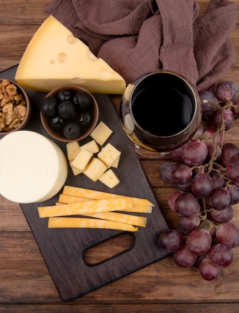 Free Photo top view table with cheese selection and wine