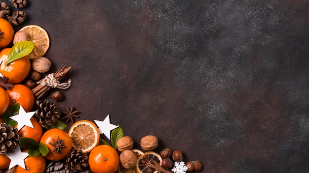 Top view of tabngerines with pine cones and walnuts for christmas