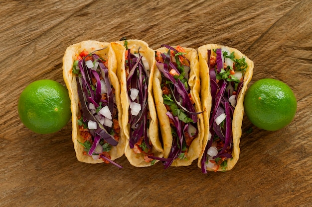 Top view tacos on wooden background