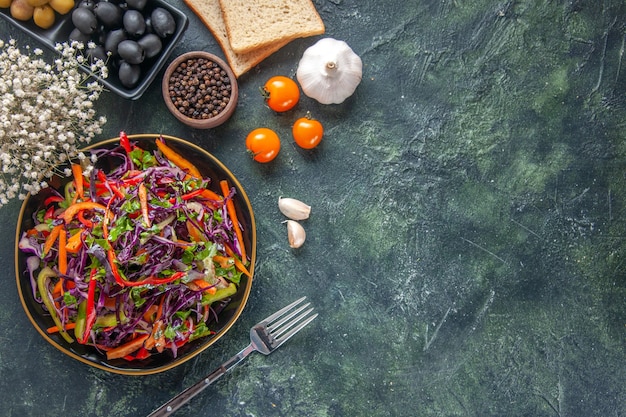 Top view tasty cabbage salad with olives and bread on dark background food bread holiday snack diet health meal lunch