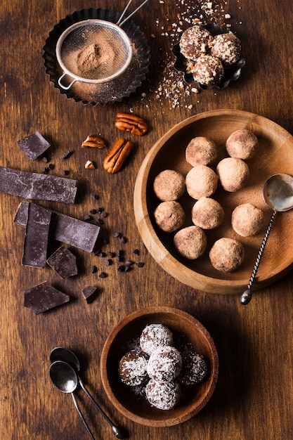 Free photo top view tasty chocolate truffles ready to be served