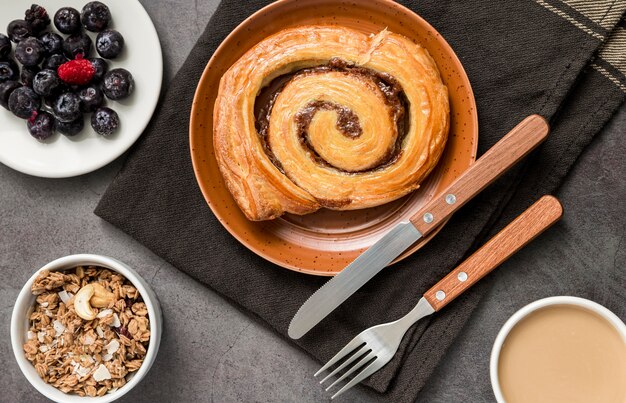 Top view tasty cinnamon roll on the table