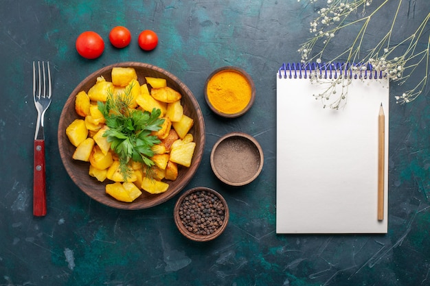 Free Photo top view tasty cooked potatoes with seasonings on dark blue background