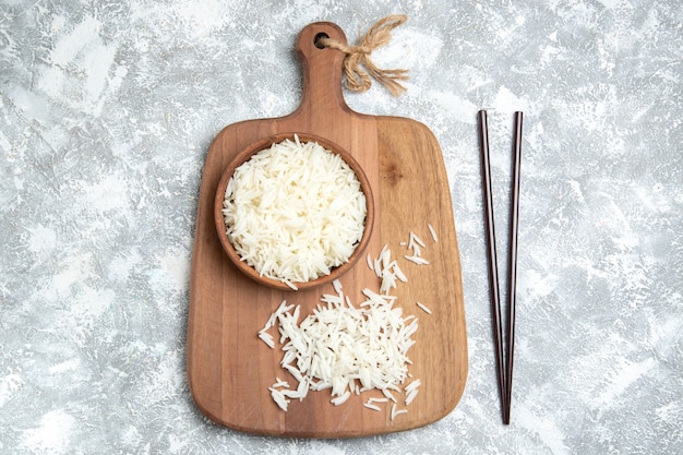 Free Photo top view tasty cooked rice inside brown plate on white