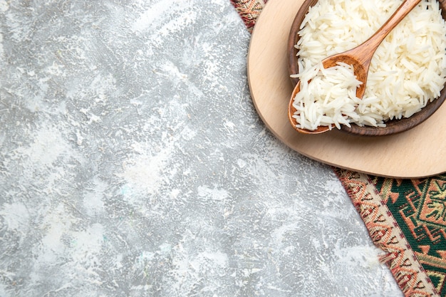 Free Photo top view tasty cooked rice inside brown plate on white