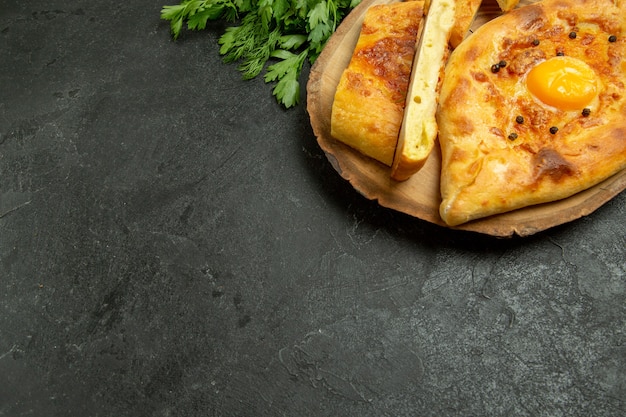 Top view tasty egg bread baked sliced with greens on the grey background bread bun dough food breakfast