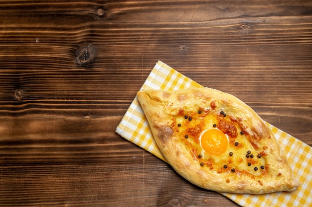 Free Photo top view tasty egg bread fresh off the oven on the brown desk dough bread bun breakfast