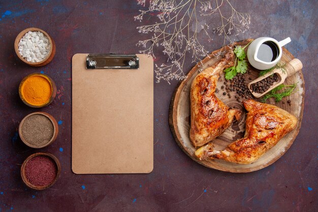 Top view tasty fried chicken with seasonings on dark background food chicken vegetables meat meal