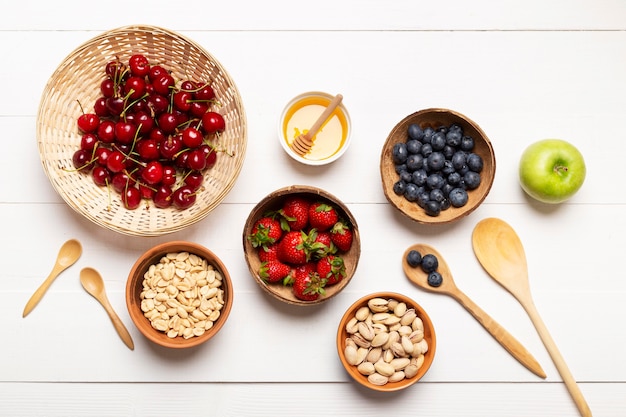 Top view tasty fruits on wooden background