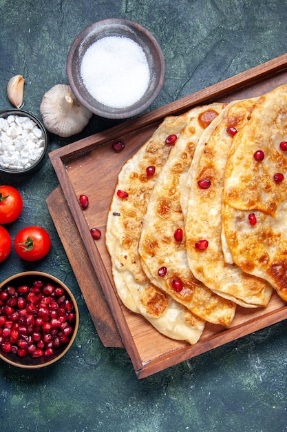 Top view tasty gutabs thin hotcakes with meat inside desk on dark background dough oven pie pastry cake meal hotcake