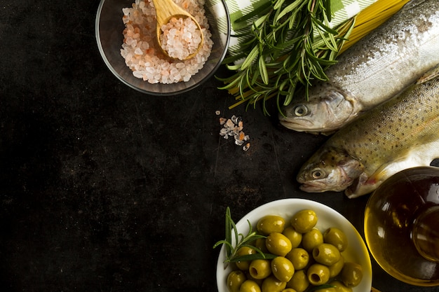 Top view of tasty ingredients on black surface