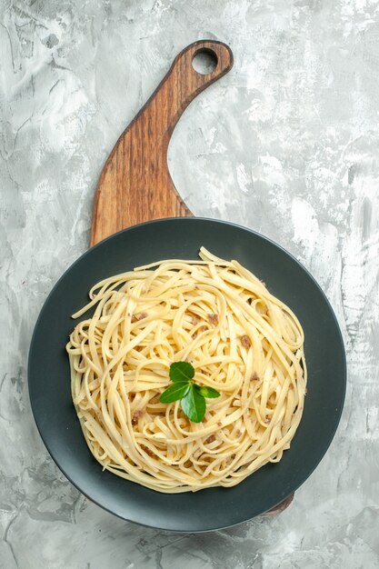 Top view tasty italian pasta inside plate on light background