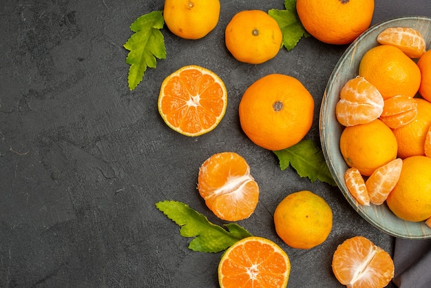 Top view tasty juicy tangerines on a dark background