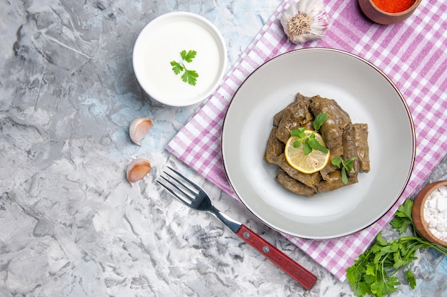 Free Photo top view of tasty leaf dolma inside plate on white surface