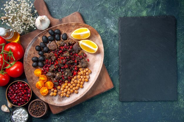 top view tasty meat slices fried meal with grapes and beans inside plate, meat dish food