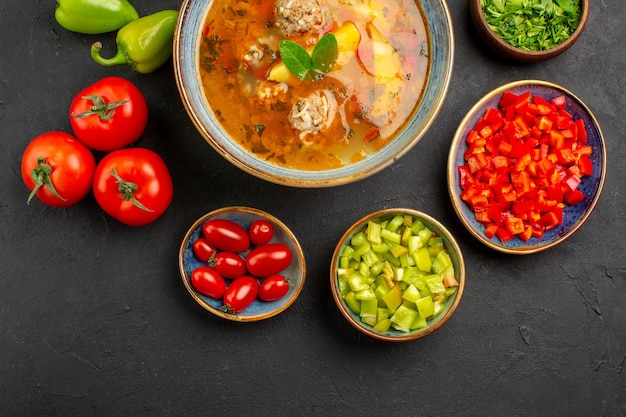 Free Photo top view tasty meat soup with fresh vegetables on a dark table food photo color dish