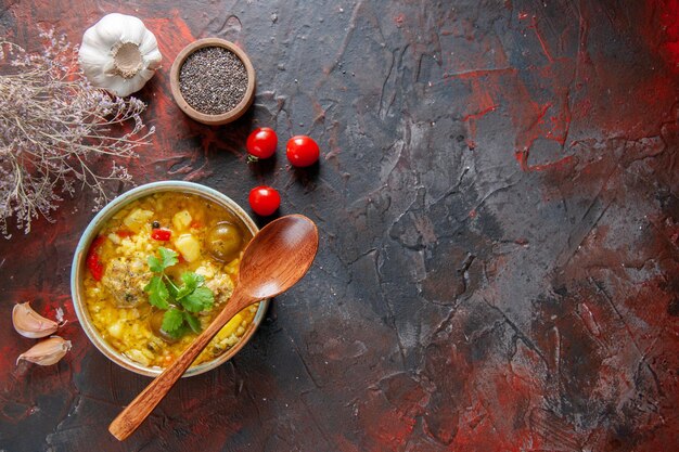 Top view tasty meat soup with potatoes and rice inside little plate on dark surface dish restaurant cuisine meal salad kitchen dinner