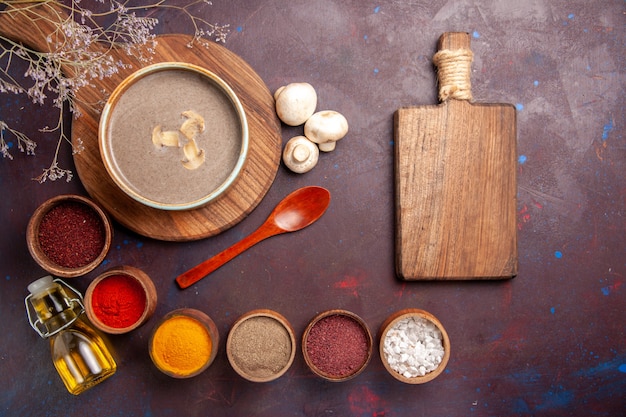 Free Photo top view tasty mushroom soup with different seasonings on a dark background soup mushroom seasoning food meal