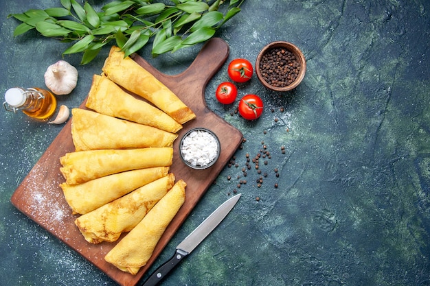 Top view tasty pancakes rolled with pepper on dark background pie meat pastry hotcake dough sweet cake meal colors