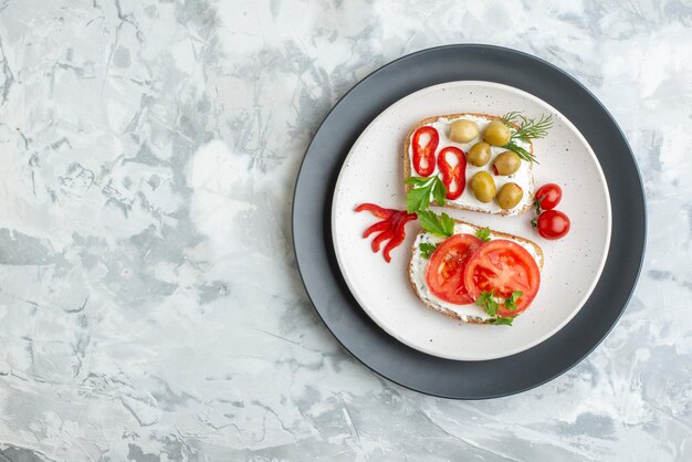 Top view tasty sandwiches with tomatoes and olives white background bread food lunch horizontal meal toast burger sandwich free space