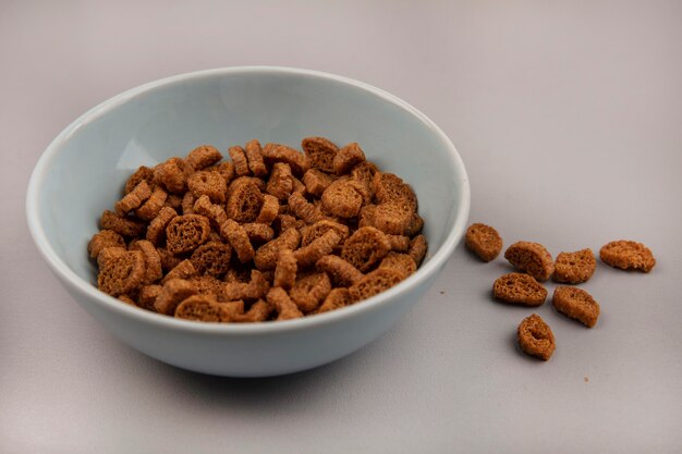 Top view of tasty small rye rusks on a bowl with rusks isolated