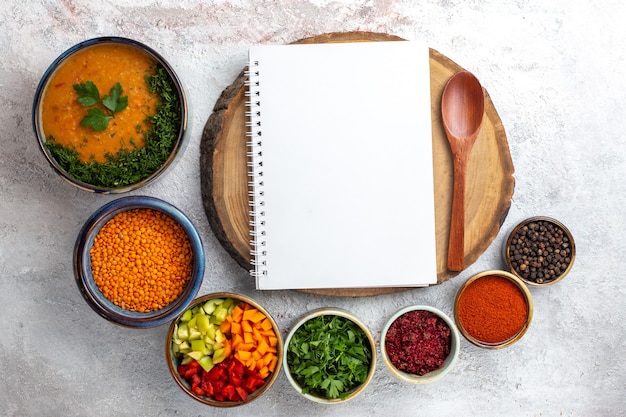 Top view tasty soup cooked bean soup with seasonings on white desk vegetables meal food soup bean