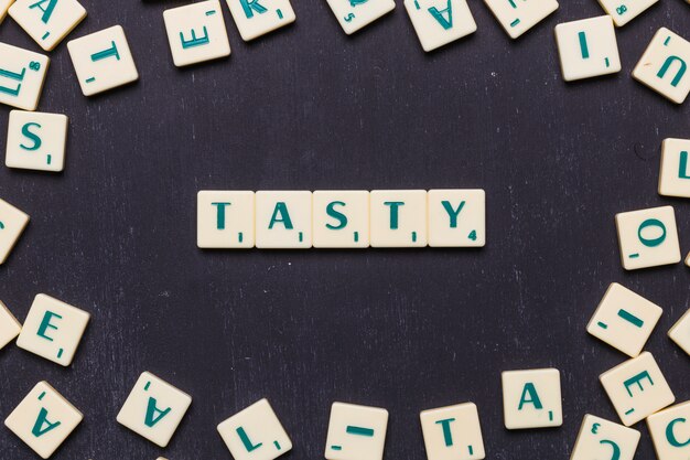 Top view of tasty text made from scrabble game letters