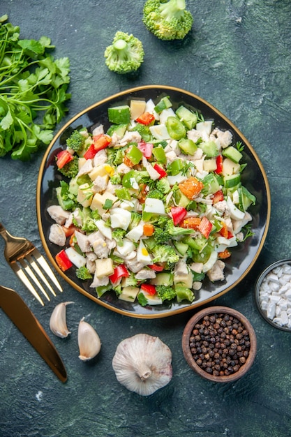 Free Photo top view tasty vegetable salad inside plate with cutlery on a dark background cuisine restaurant fresh meal color health lunch diet