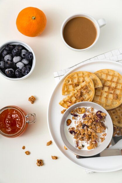 Top view tasty waffles with blueberries