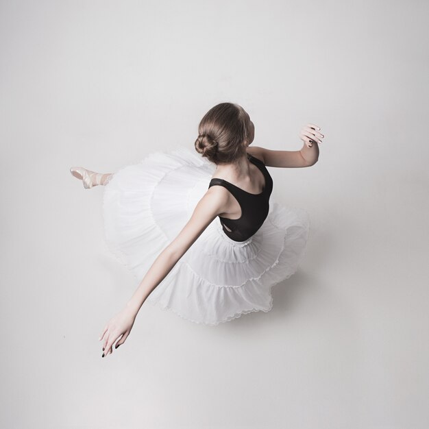 The top view of the teen ballerina on white space