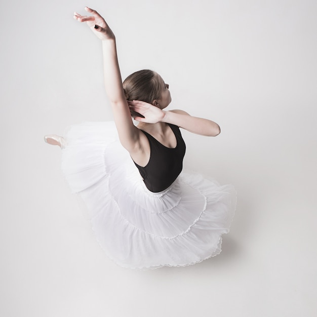 The top view of the teen ballerina on white