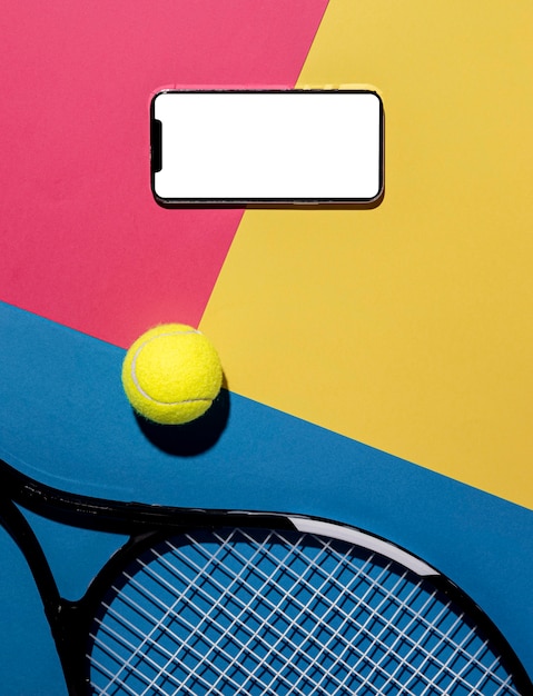 Free photo top view of tennis ball with racket and smartphone