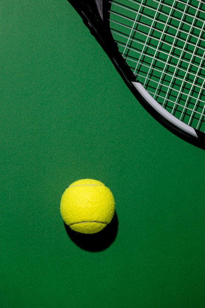 Top view of tennis ball with racket