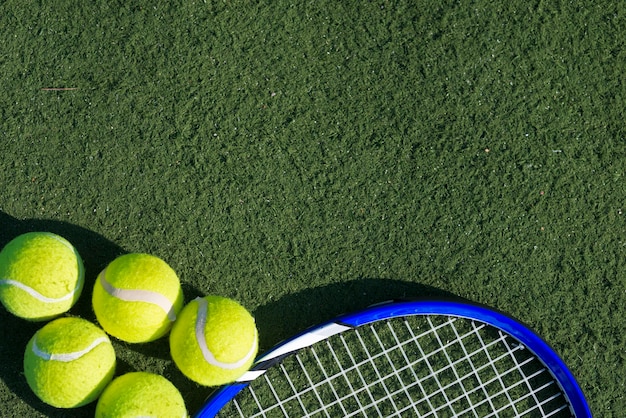 Free Photo top view tennis balls and racket