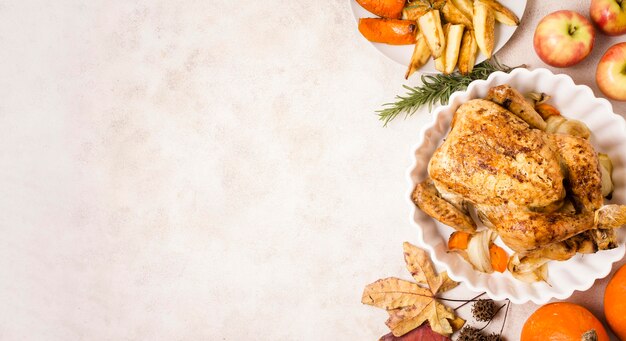 Top view of thanksgiving roasted chicken on plate with copy space