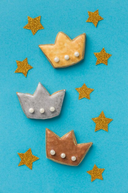 Top view of three crowns with stars for epiphany day