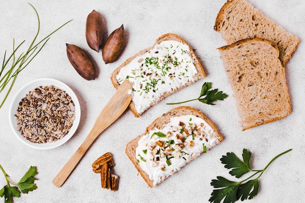 Free photo top view of toast with spread and walnuts