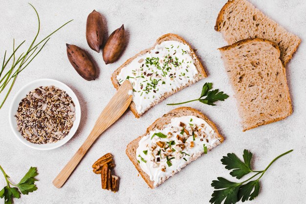 Top view of toast with spread and walnuts