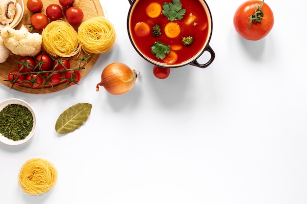 Top view tomato soup and pasta