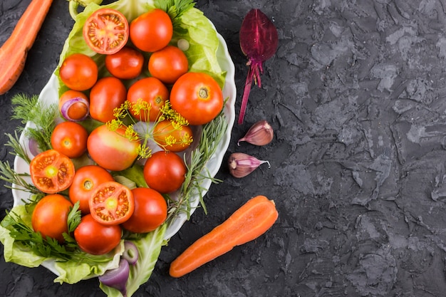 Top view tomatoes and vegetables with copy space