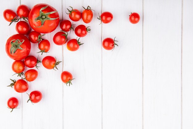 Top view of tomatoes on wooden surface