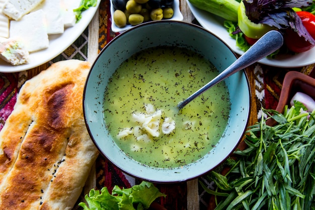 Free photo top view a traditional azerbaijani dish dushbara with bread and olivesjpg