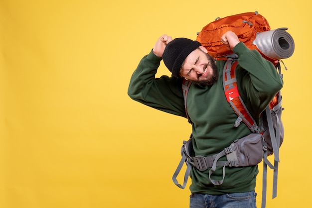 Free photo top view of travel concept with troubled young guy with packpack