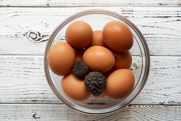 Free photo top view truffles and eggs in bowl