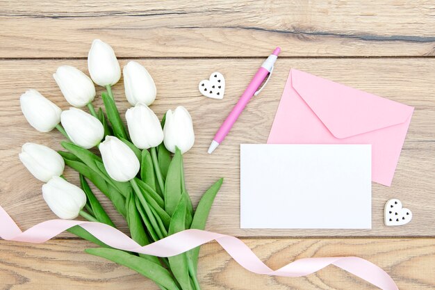 Top view of tulips bouquet on wooden table