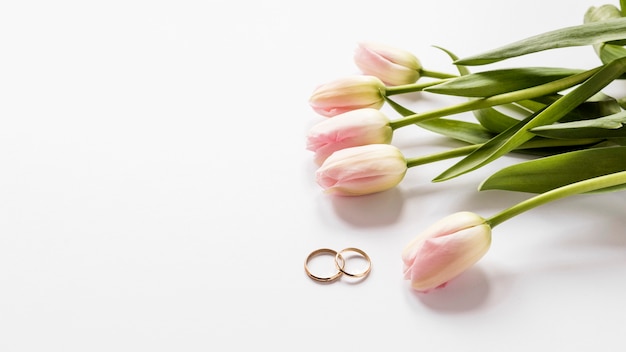 Free Photo top view tulips and engagement rings